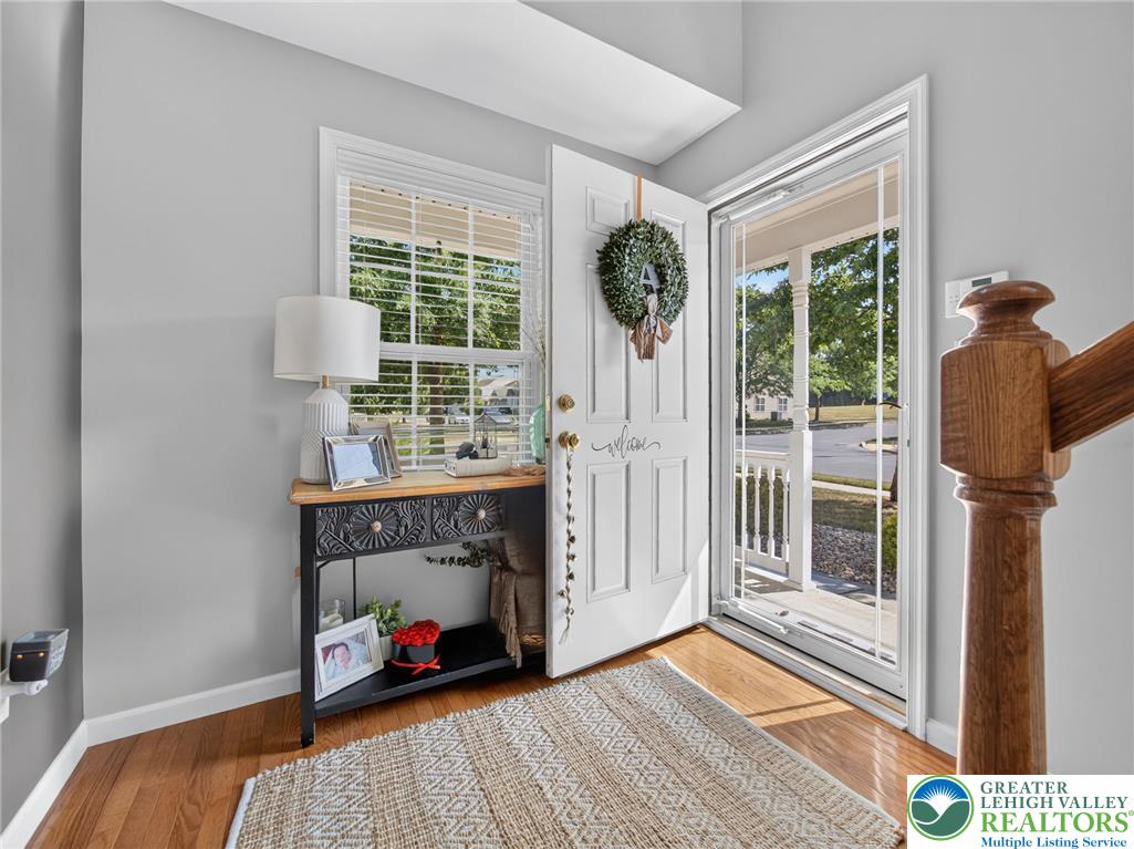4148 Ross Road Bethlehem, PA 18020 - Photo 21 of 67 Step into a welcoming entry featuring rich hardwood flooring and a brightly lit foyer.