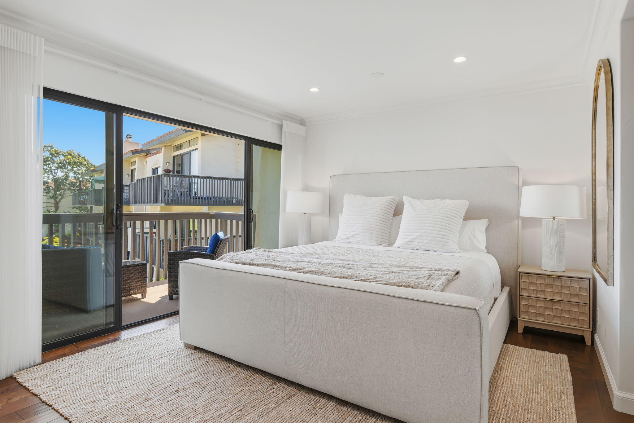 3375 Foothill Road, Unit 722 Carpinteria, CA 93013 - Photo 16 of 33 a bedroom with a large bed and a large window