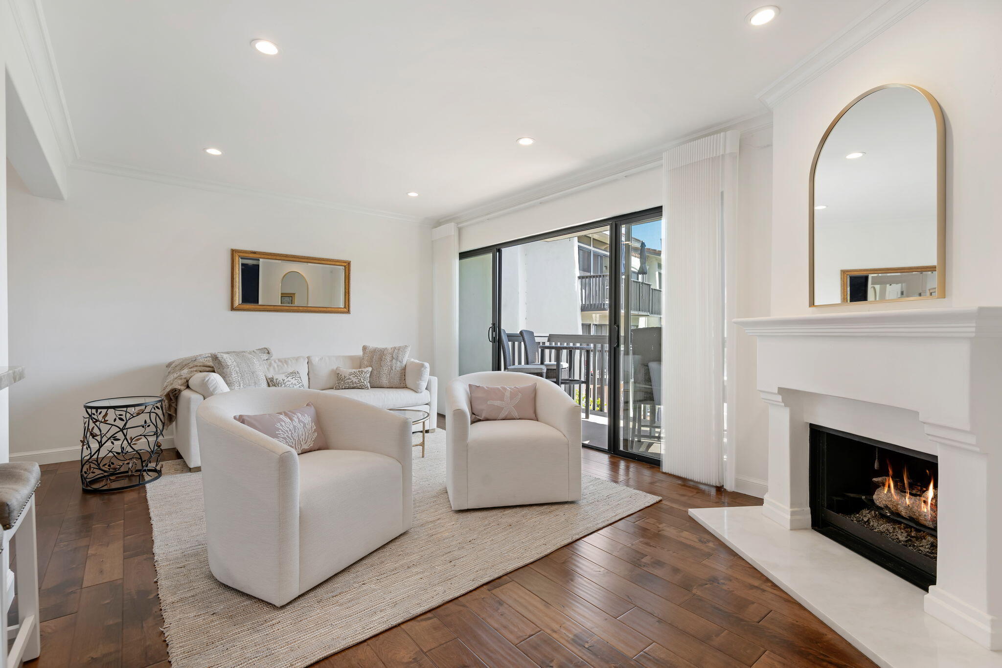 3375 Foothill Road, Unit 722 Carpinteria, CA 93013 - Photo 2 of 33 a living room with furniture and a fireplace