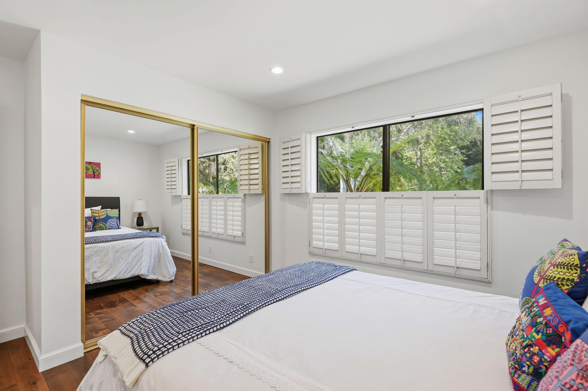 3375 Foothill Road, Unit 722 Carpinteria, CA 93013 - Photo 28 of 33 a bedroom with a bed and wooden floor