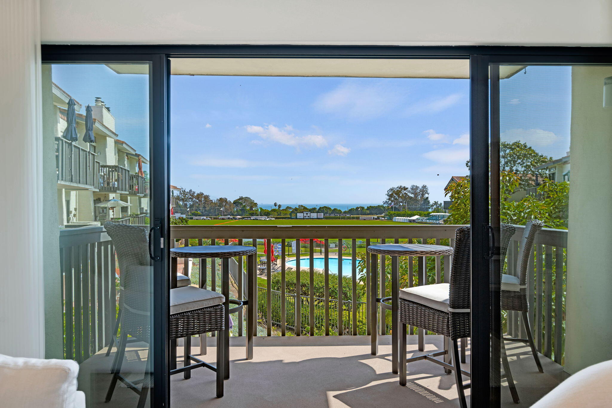3375 Foothill Road, Unit 722 Carpinteria, CA 93013 - Photo 6 of 33 a view of a city from a balcony with furniture