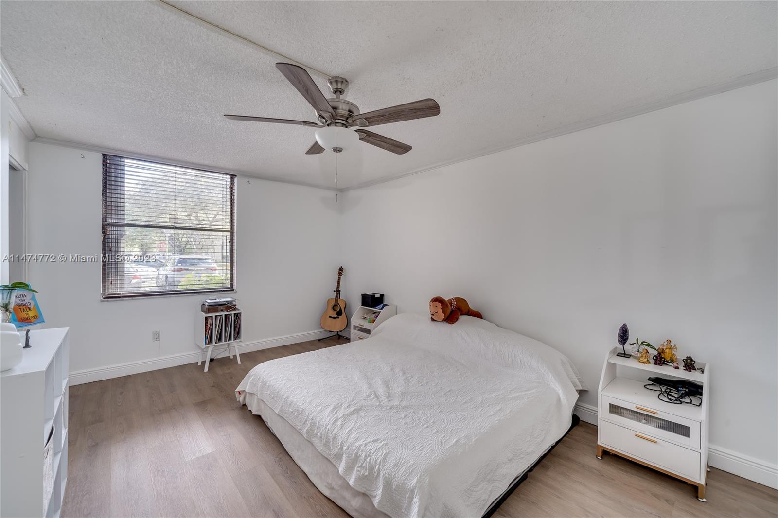 Promenade at Kendale Lakes Condominiums Miami, FL 33186 - Photo 13 of 29 a bed room with a bed and a window