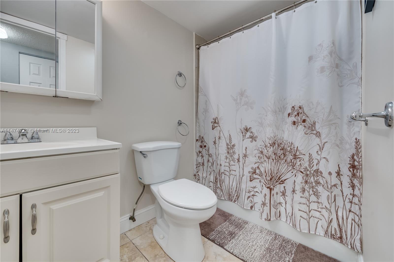 Promenade at Kendale Lakes Condominiums Miami, FL 33186 - Photo 19 of 29 a white toilet sitting next to a bathroom sink