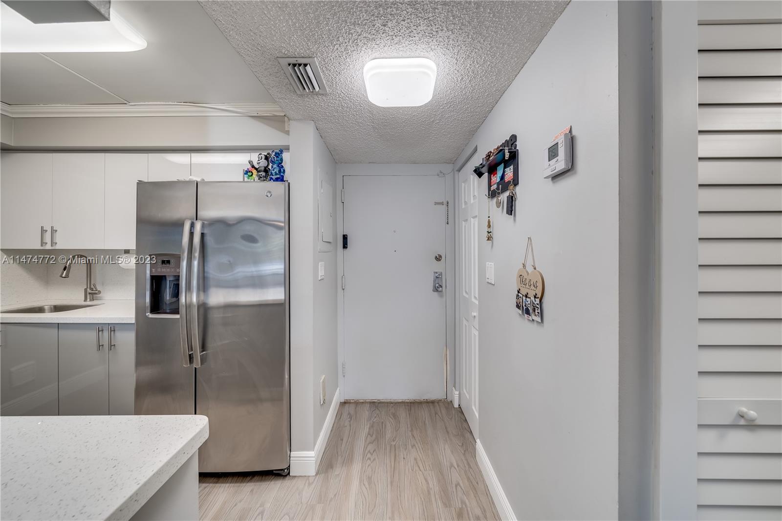Promenade at Kendale Lakes Condominiums Miami, FL 33186 - Photo 2 of 29 a bathroom with a tub shower vanity and a sink