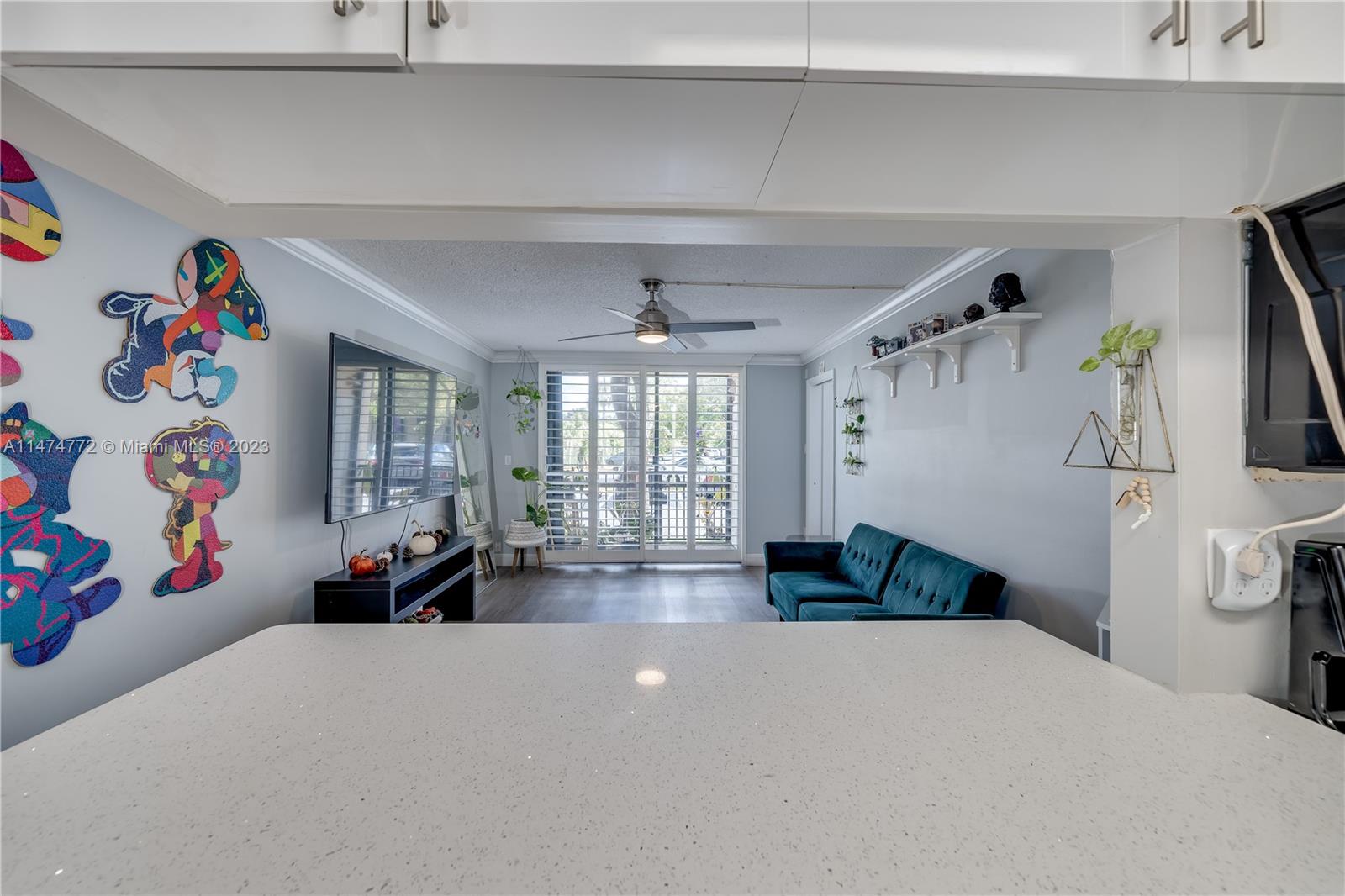 Promenade at Kendale Lakes Condominiums Miami, FL 33186 - Photo 5 of 29 a living room with furniture and a table