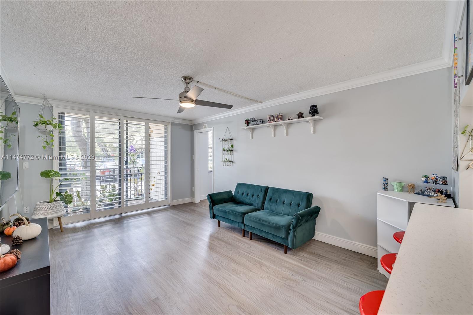 Promenade at Kendale Lakes Condominiums Miami, FL 33186 - Photo 6 of 29 a living room with furniture and a large window