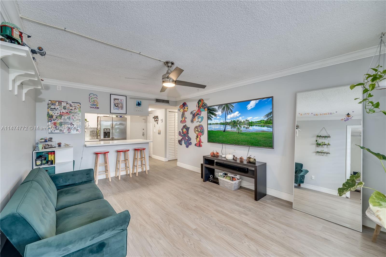 Promenade at Kendale Lakes Condominiums Miami, FL 33186 - Photo 9 of 29 a living room with furniture and a flat screen tv