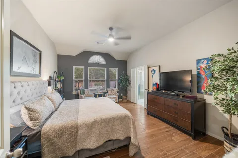 a bathroom with a bathtub a sink and a mirror
