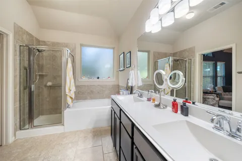 a bathroom with a sink mirror and toilet