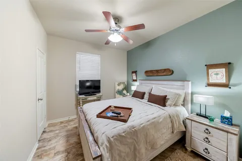 a living room with furniture a air conditioner and a window