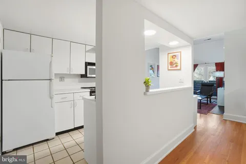 a white refrigerator freezer sitting inside of a kitchen