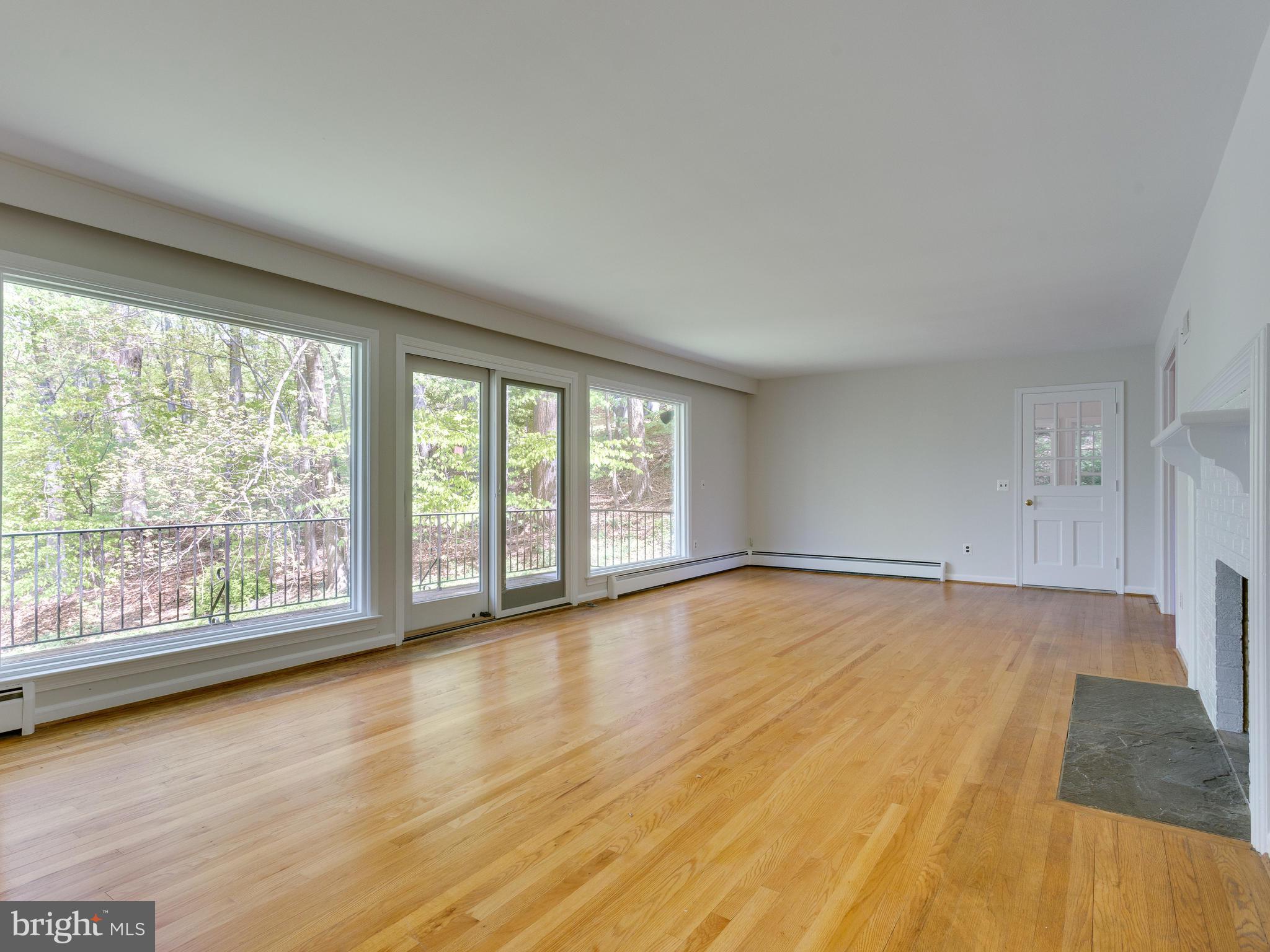 7828 Langley Ridge Road McLean, VA 22102 - Photo 9 of 28 Living Room Looks Out to Private Wooded Lot