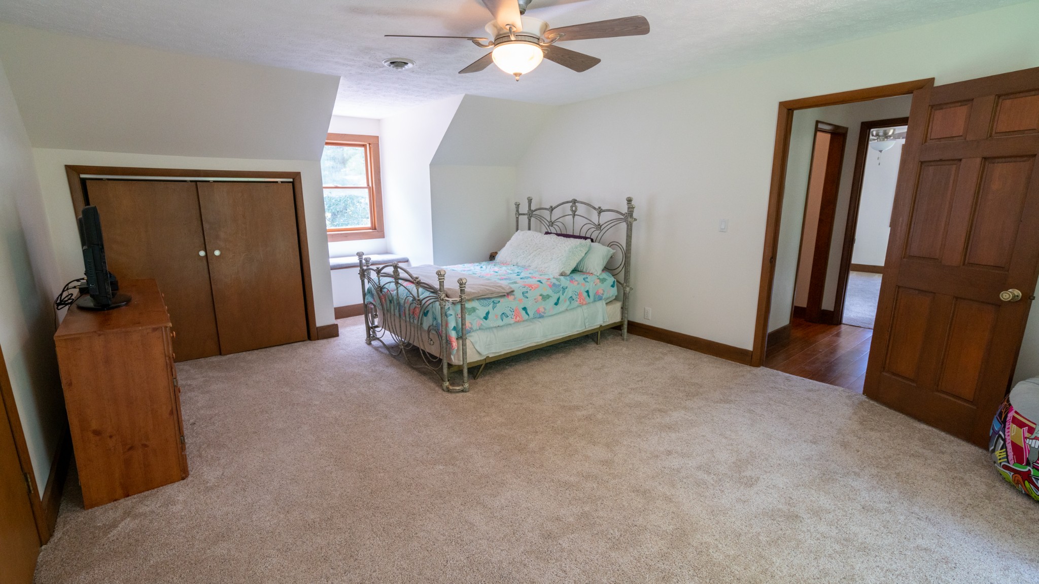 175 Fairview Road Dickson, TN 37055 - Photo 35 of 49 a livingroom with a bed and a ceiling fan
