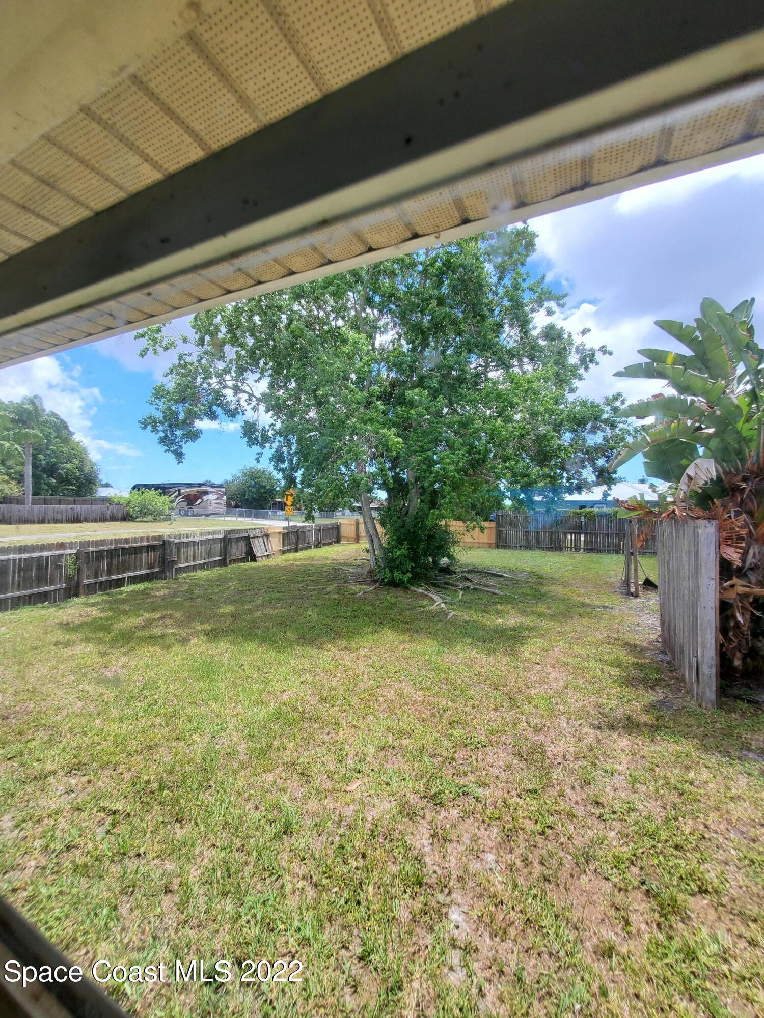 1195 Cotton Road Northeast Palm Bay, FL 32905 - Photo 15 of 35 left side of house