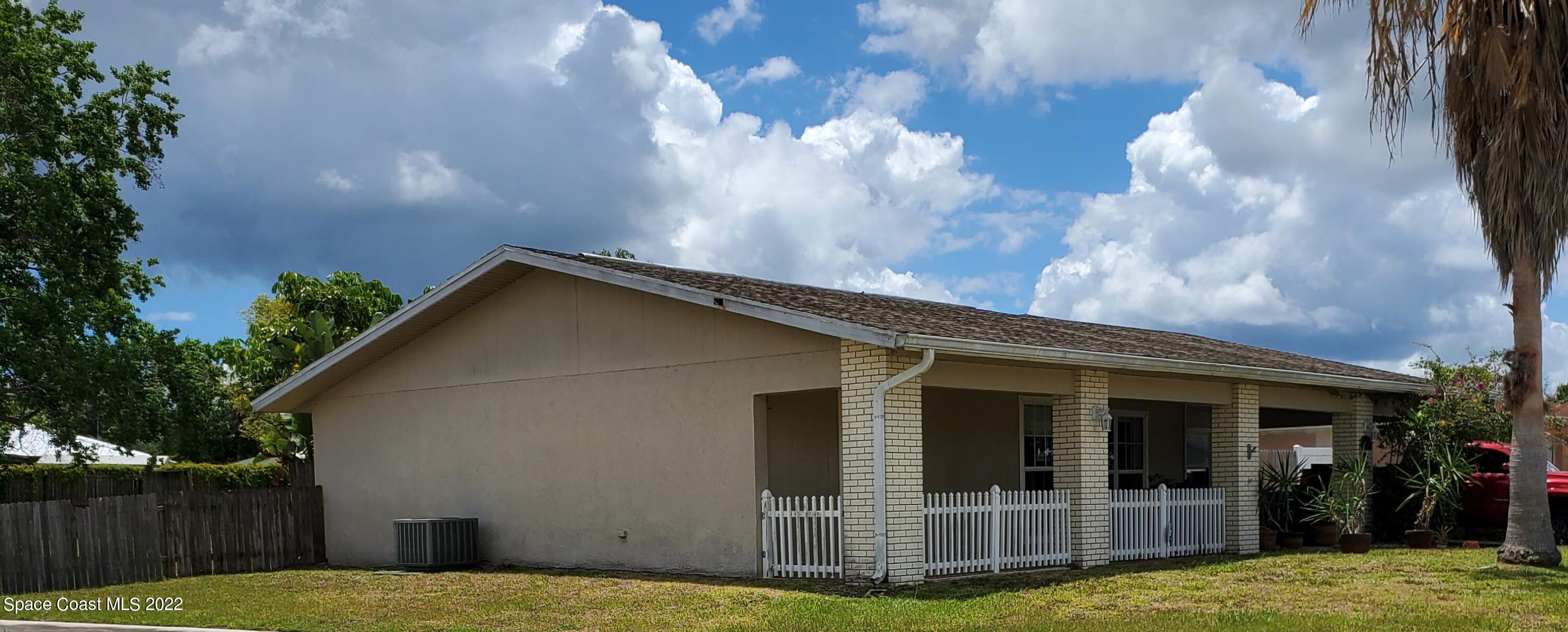 1195 Cotton Road Northeast Palm Bay, FL 32905 - Photo 2 of 35 side of house