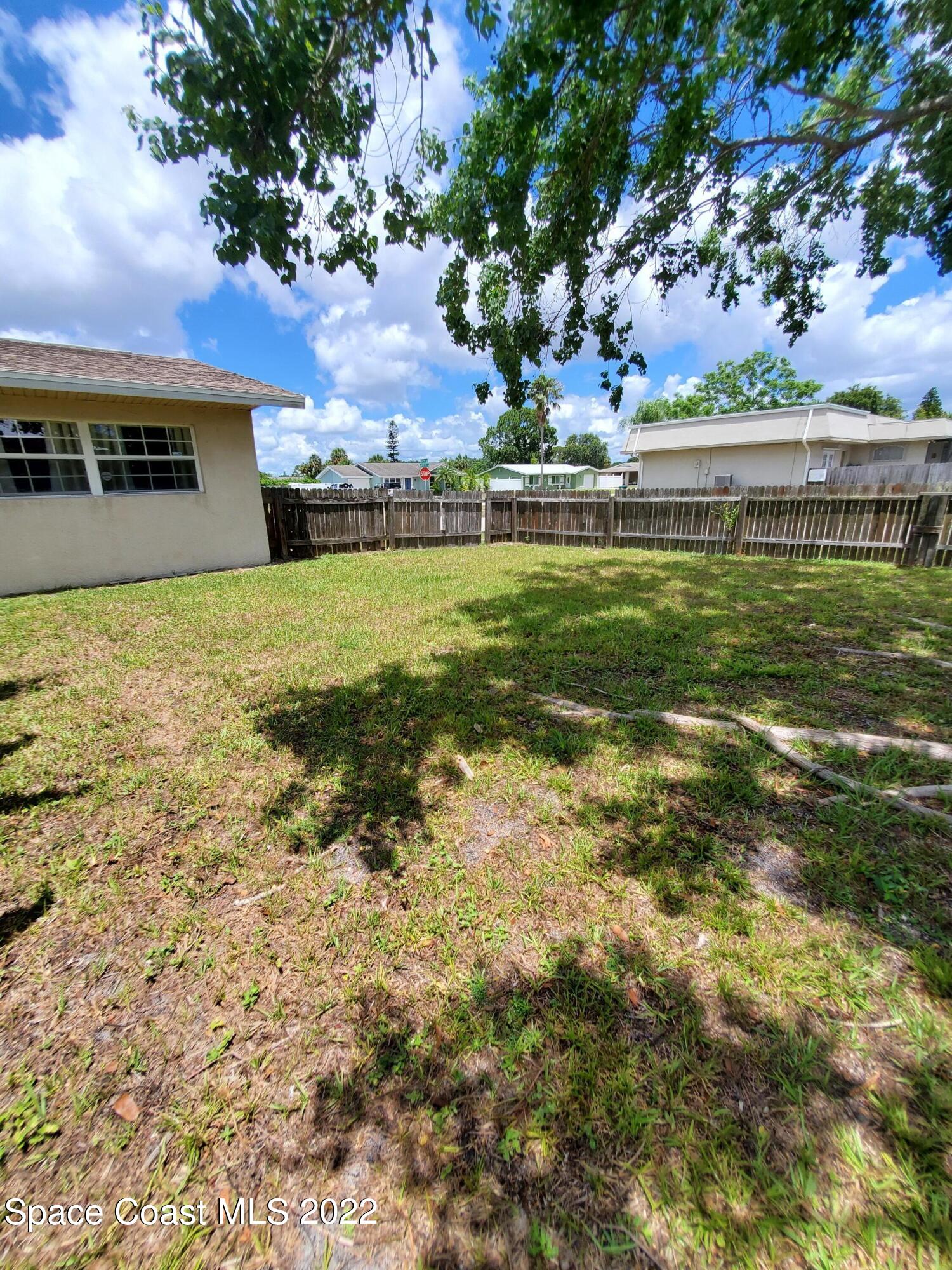 1195 Cotton Road Northeast Palm Bay, FL 32905 - Photo 25 of 35 left side of yard space