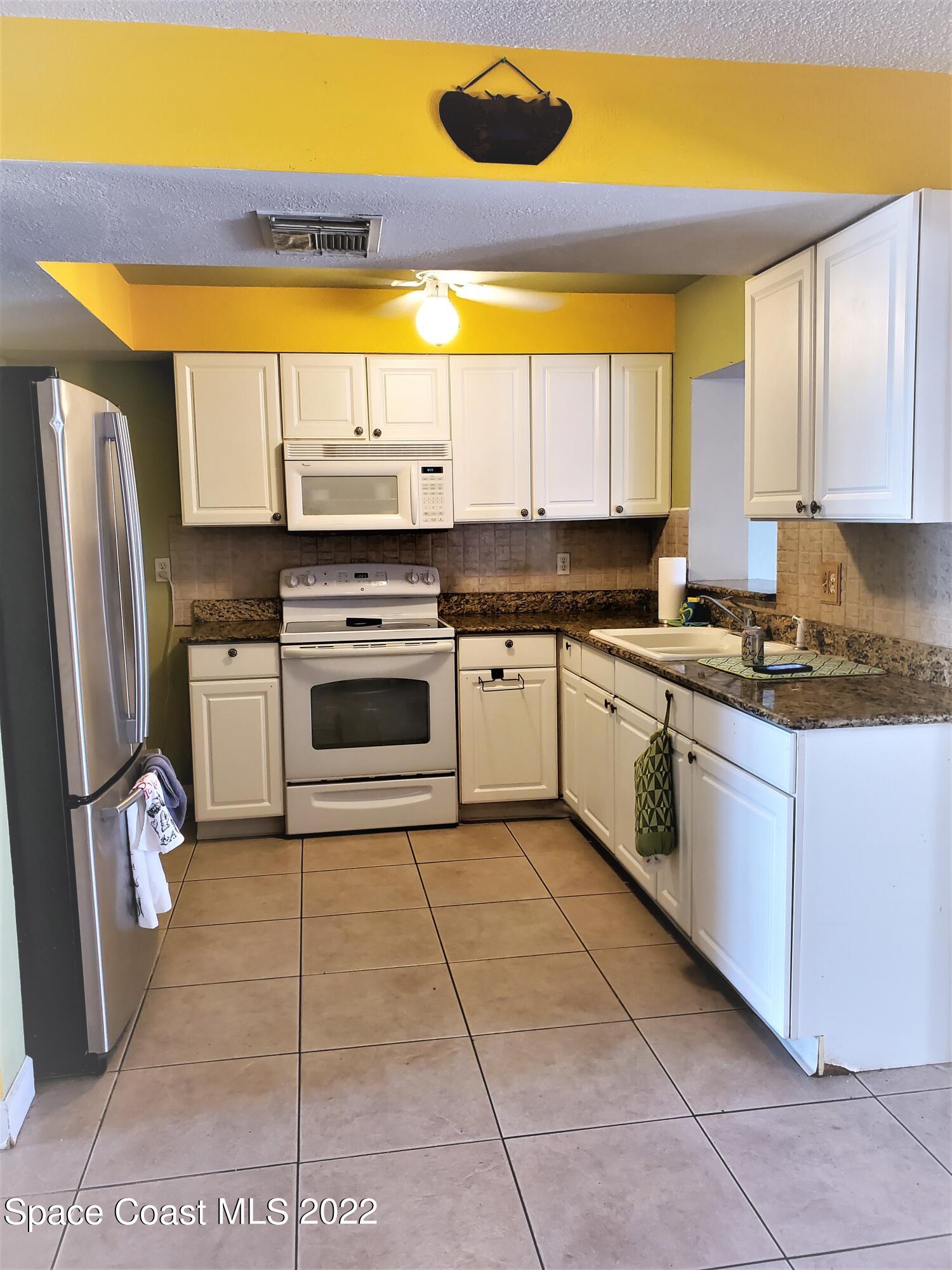 1195 Cotton Road Northeast Palm Bay, FL 32905 - Photo 31 of 35 kitchen
