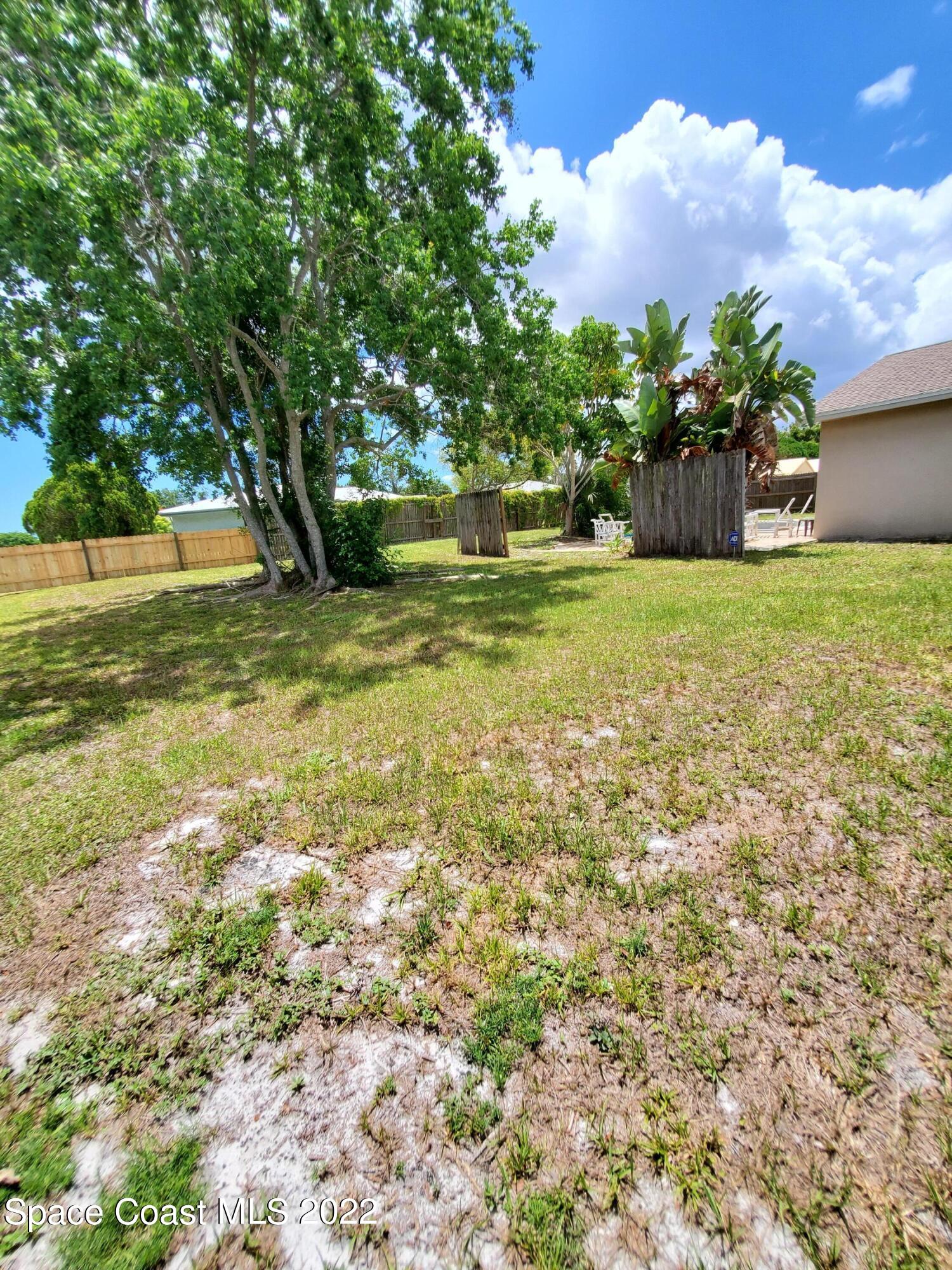 1195 Cotton Road Northeast Palm Bay, FL 32905 - Photo 33 of 35 left side back yard towards pool