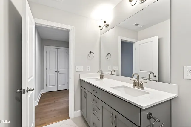 a bathroom with a sink and mirror