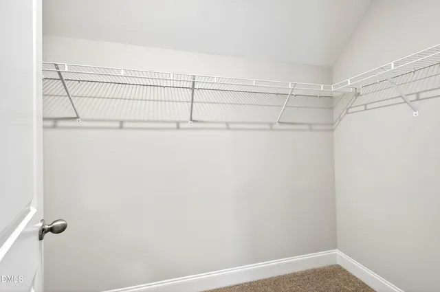 a view of a small space with racks on the wall