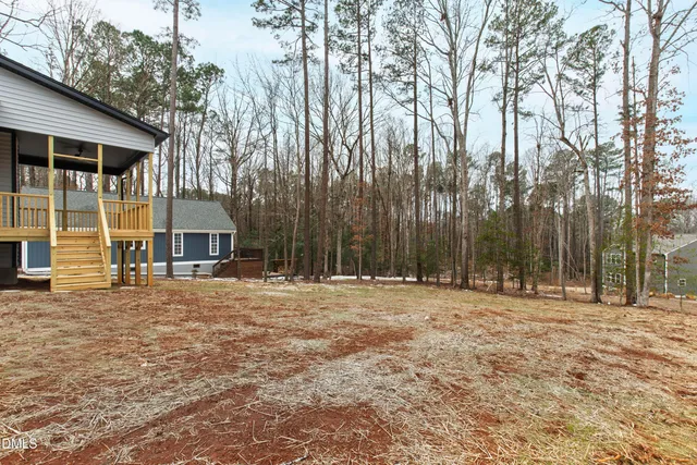 a view of a swimming pool with an outdoor space and seating area