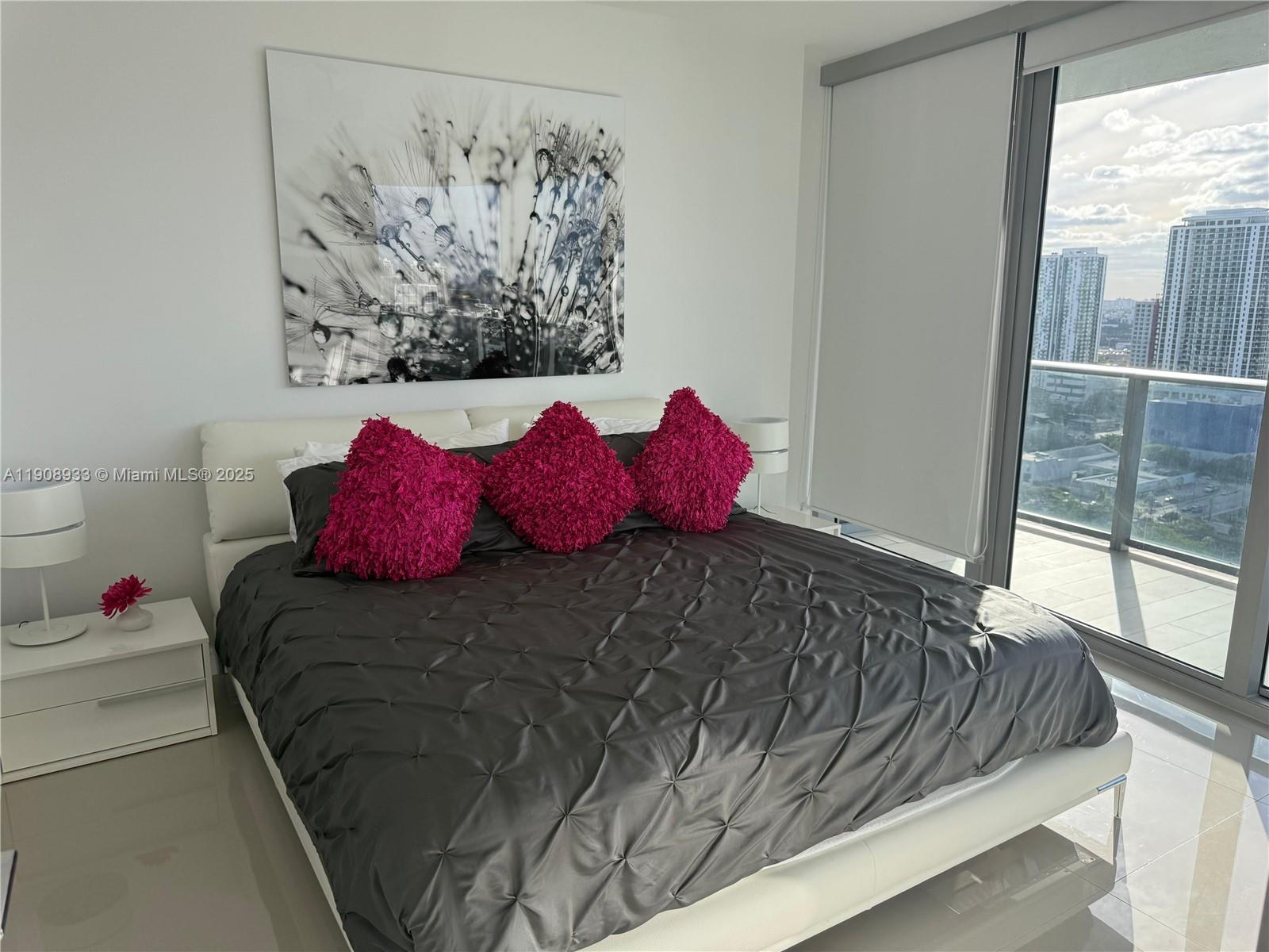 488 Northeast 18th Street, Unit 2701 Miami, FL 33132 - Photo 11 of 70 a bedroom with a bed and a window