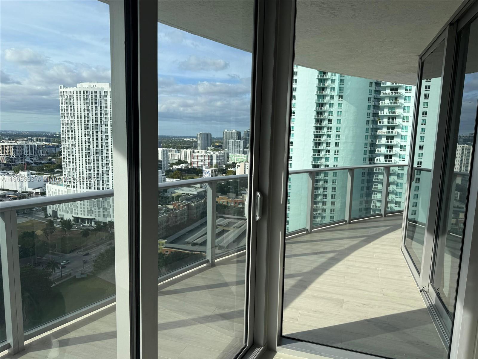 488 Northeast 18th Street, Unit 2701 Miami, FL 33132 - Photo 14 of 70 a view of a glass door and a window