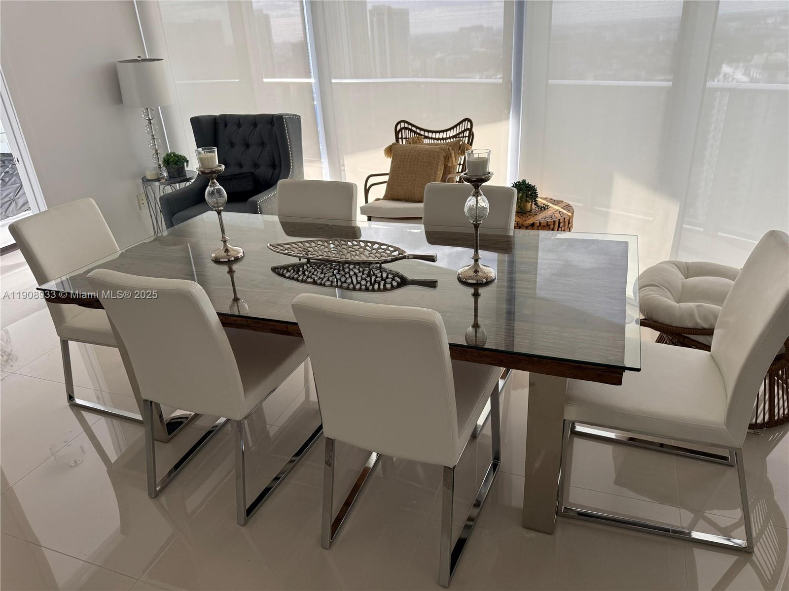 488 Northeast 18th Street, Unit 2701 Miami, FL 33132 - Photo 4 of 70 a living room with furniture and a fireplace