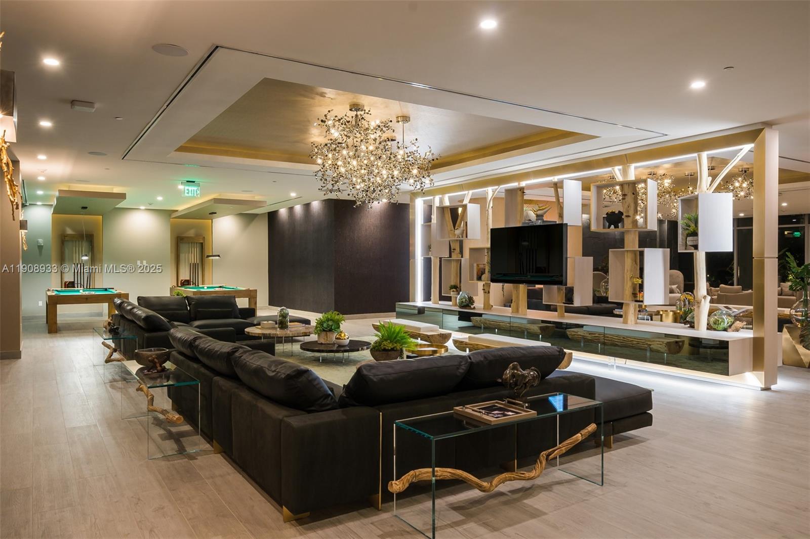 488 Northeast 18th Street, Unit 2701 Miami, FL 33132 - Photo 58 of 70 a living room with furniture and a flat screen tv