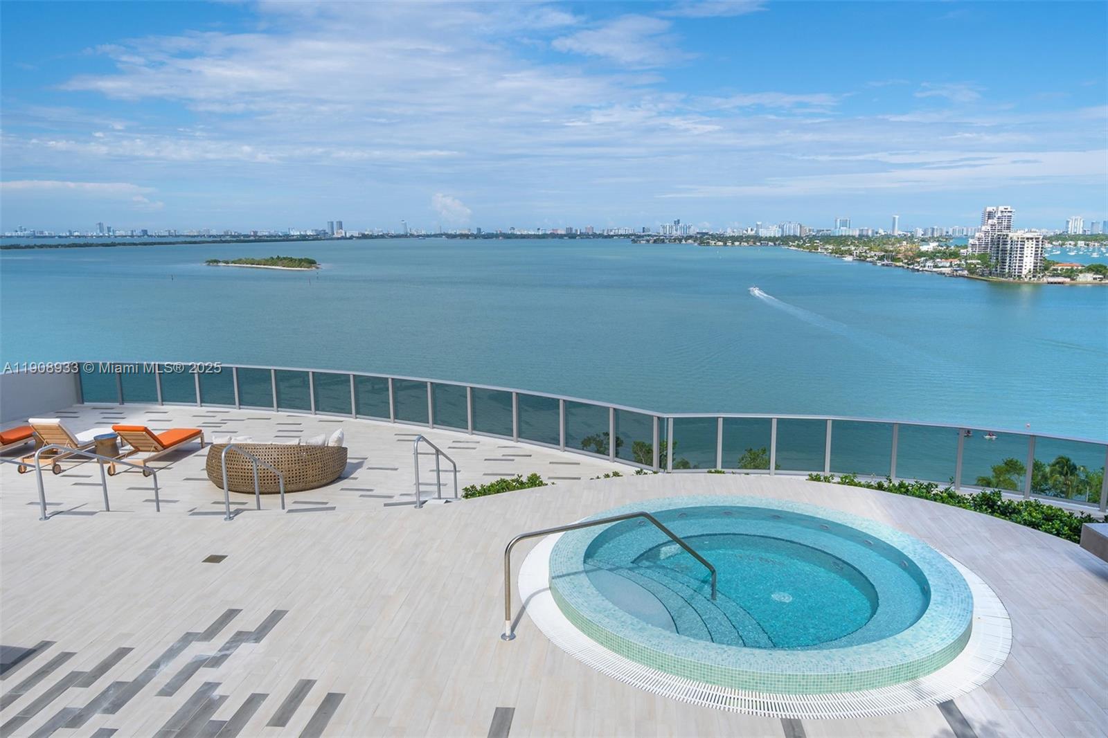 488 Northeast 18th Street, Unit 2701 Miami, FL 33132 - Photo 63 of 70 a view of a swimming pool with lounge chairs