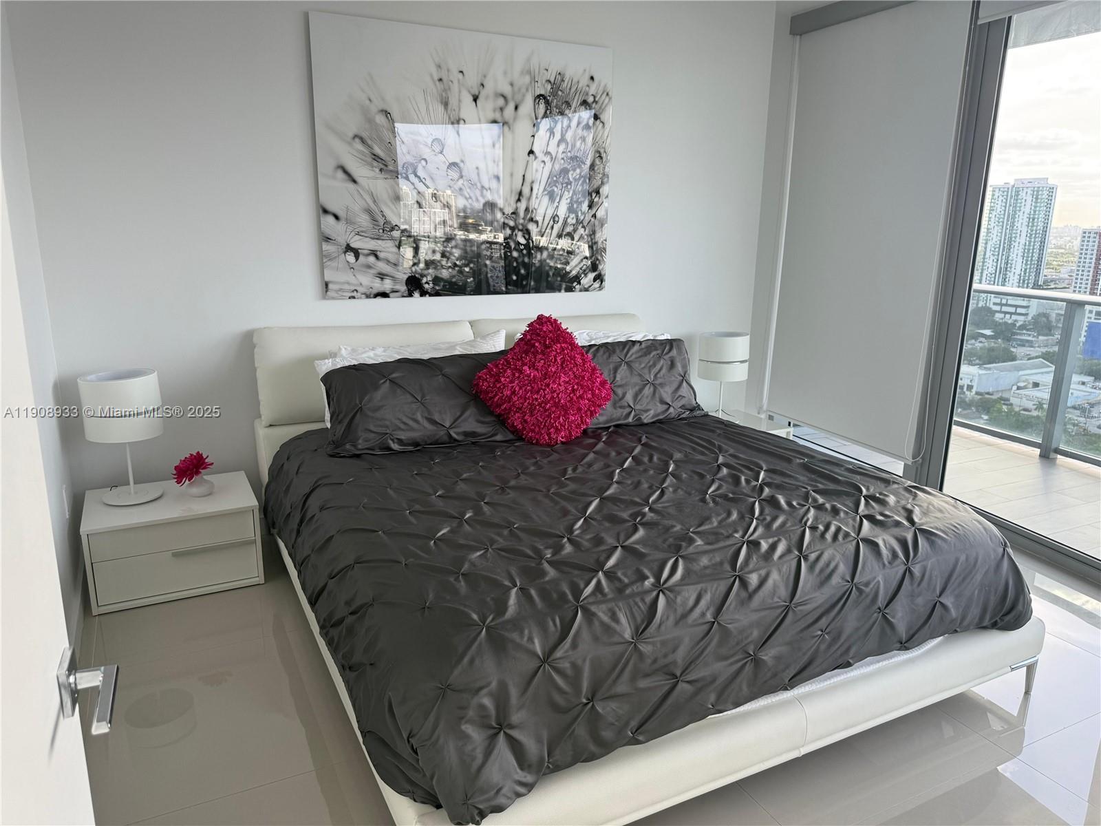 488 Northeast 18th Street, Unit 2701 Miami, FL 33132 - Photo 70 of 70 a bedroom with a bed and a window