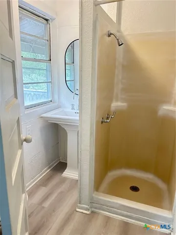 a bathroom with a bath tub and a shower