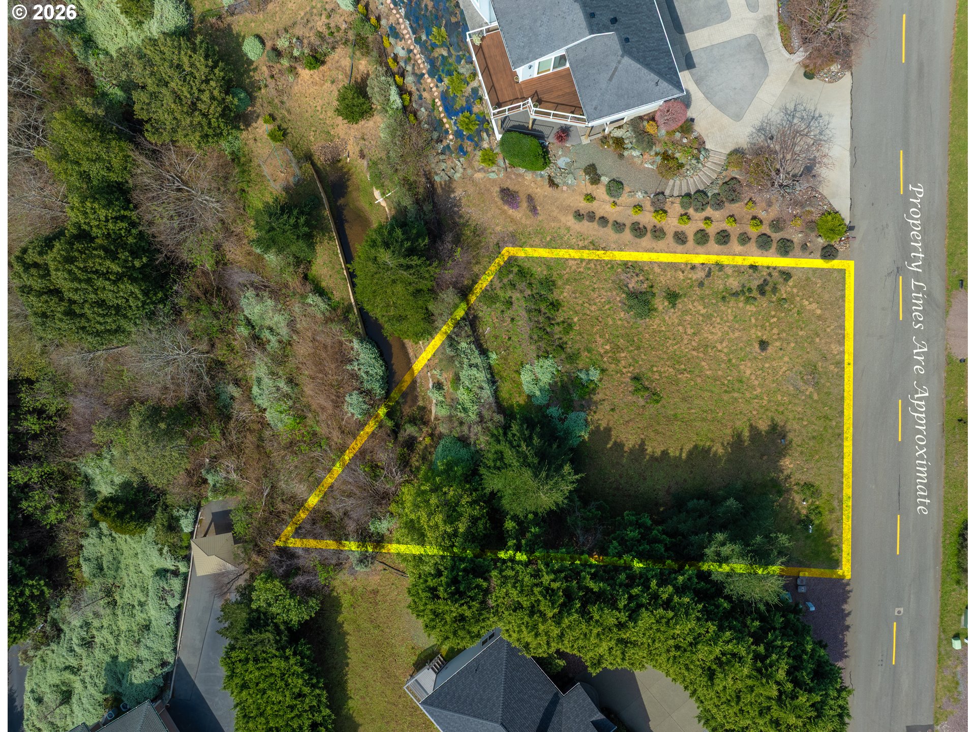 98010 Crown Terrace, Unit 1 Brookings, OR 97415 - Photo 2 of 10 an aerial view of a residential houses with yard