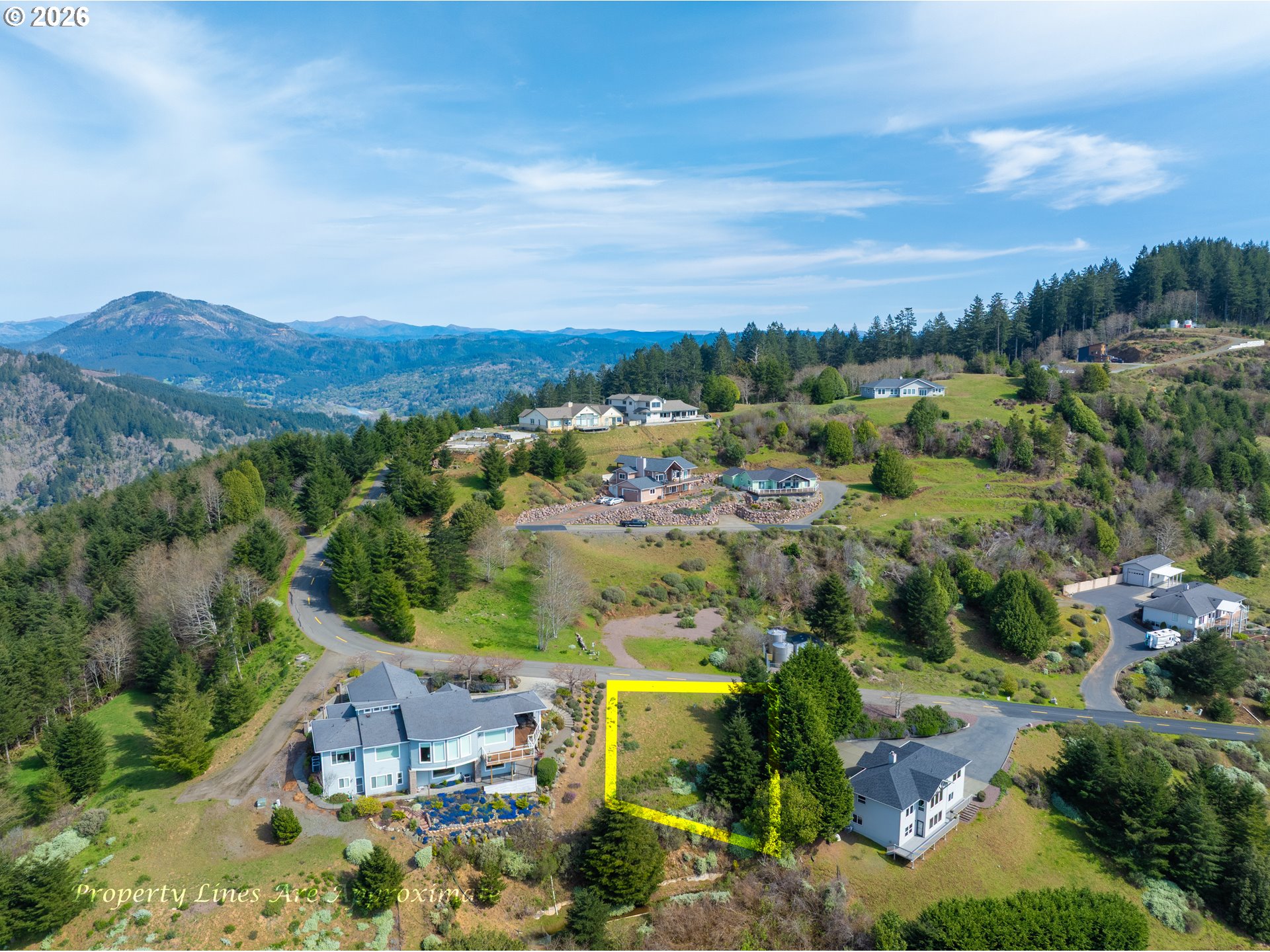 98010 Crown Terrace, Unit 1 Brookings, OR 97415 - Photo 3 of 10 an aerial view of residential house with outdoor space