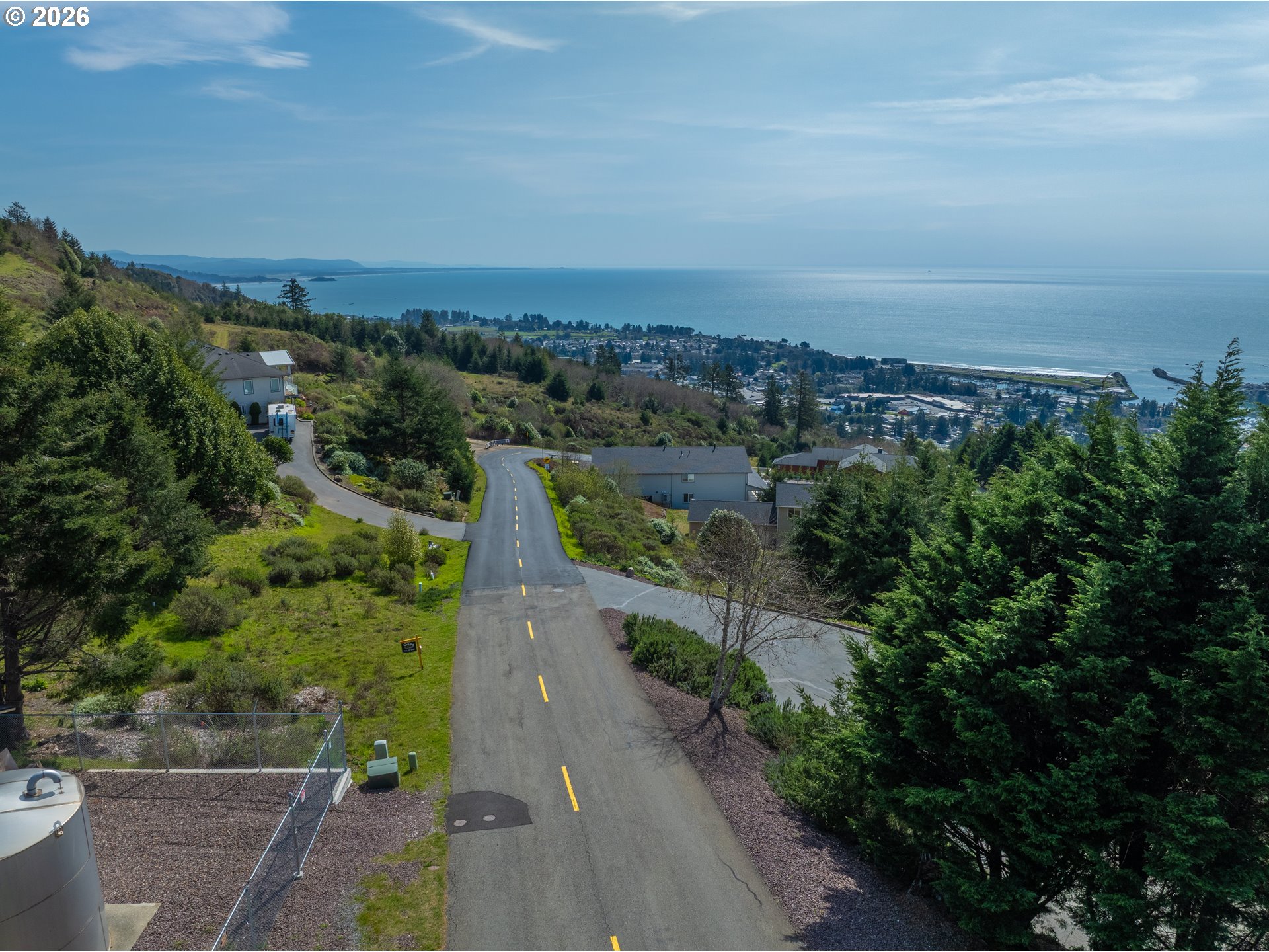 98010 Crown Terrace, Unit 1 Brookings, OR 97415 - Photo 6 of 10 an aerial view of a city with lots of residential buildings
