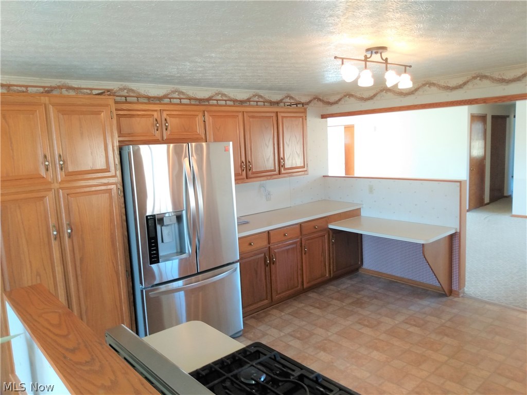 9643 Tallmadge Road Diamond, OH 44412 - Photo 10 of 35 This roomy kitchen features all the cabinets and storage you could need. Recently updated with newer appliances.