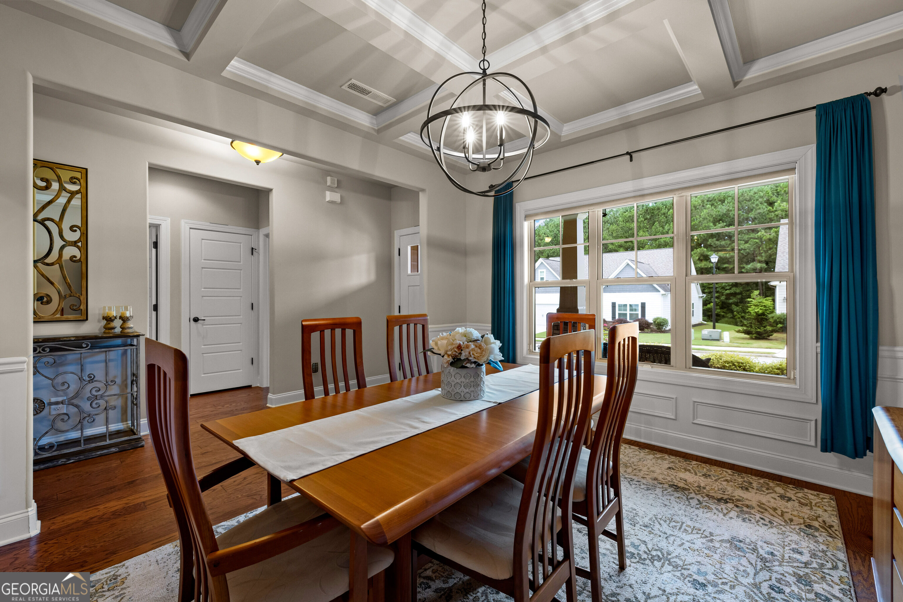 12 Delaware Way Newnan, GA 30265 - Photo 12 of 61 Dining room view showing the china cabinet and natural light from front-facing windows.