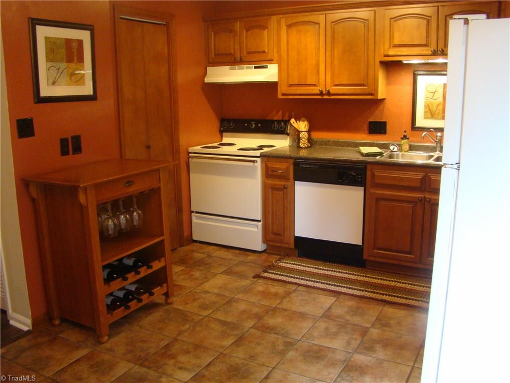228 Northpoint Avenue, Unit A High Point, NC 27262 - Photo 7 of 11 Kitchen with tile and pantry door