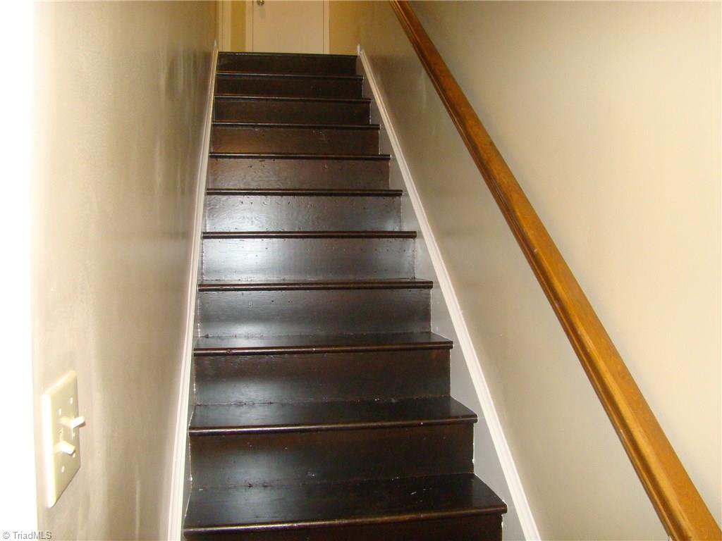 228 Northpoint Avenue, Unit A High Point, NC 27262 - Photo 8 of 11 Wood staircase to 2nd floor