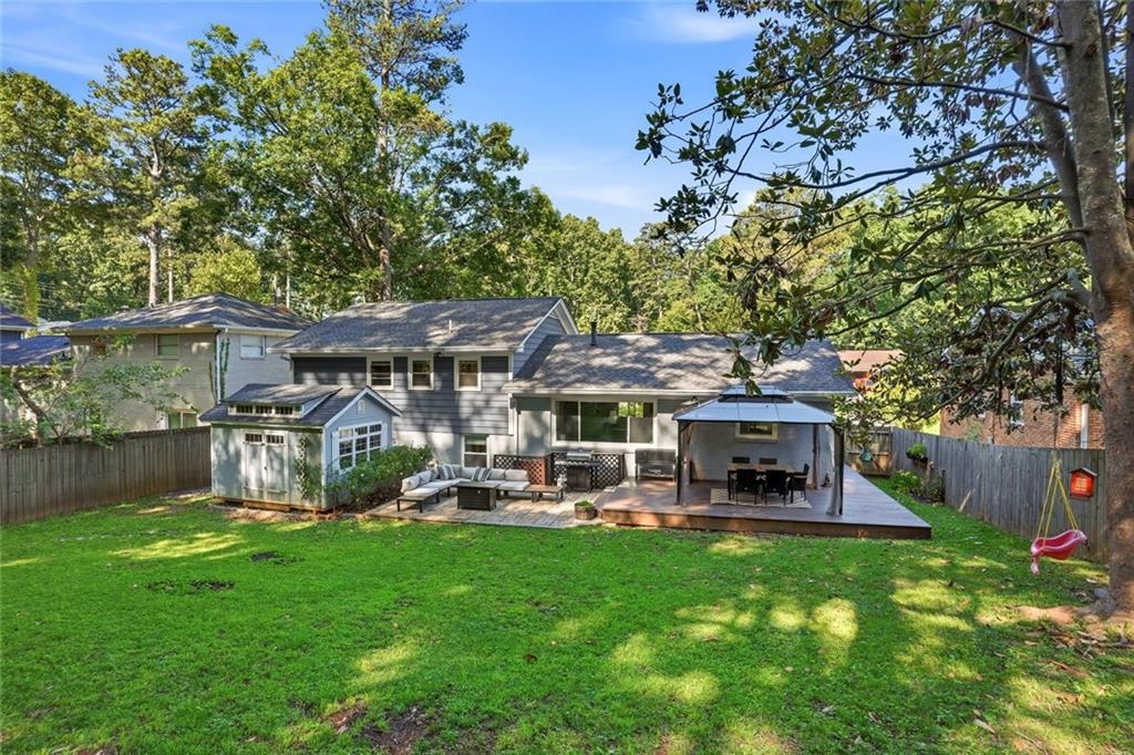 1430 Thomas Road Decatur, GA 30030 - Photo 35 of 42 a view of a house with a yard porch and sitting area