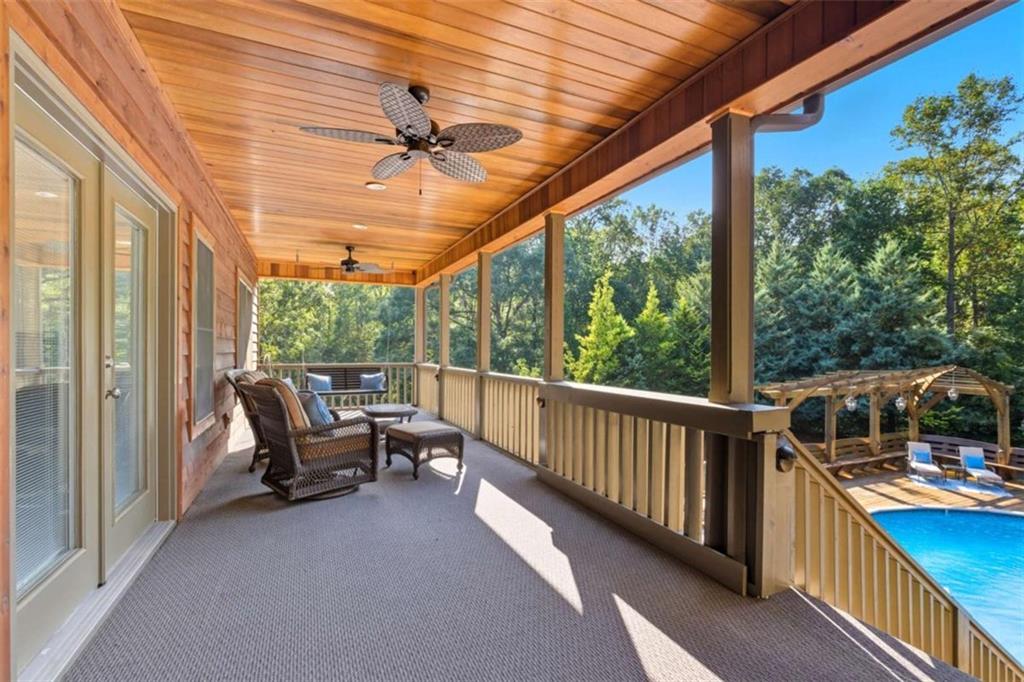 1091 Echota Road Clarkesville, GA 30523 - Photo 69 of 89 a view of a balcony with couch and wooden floor