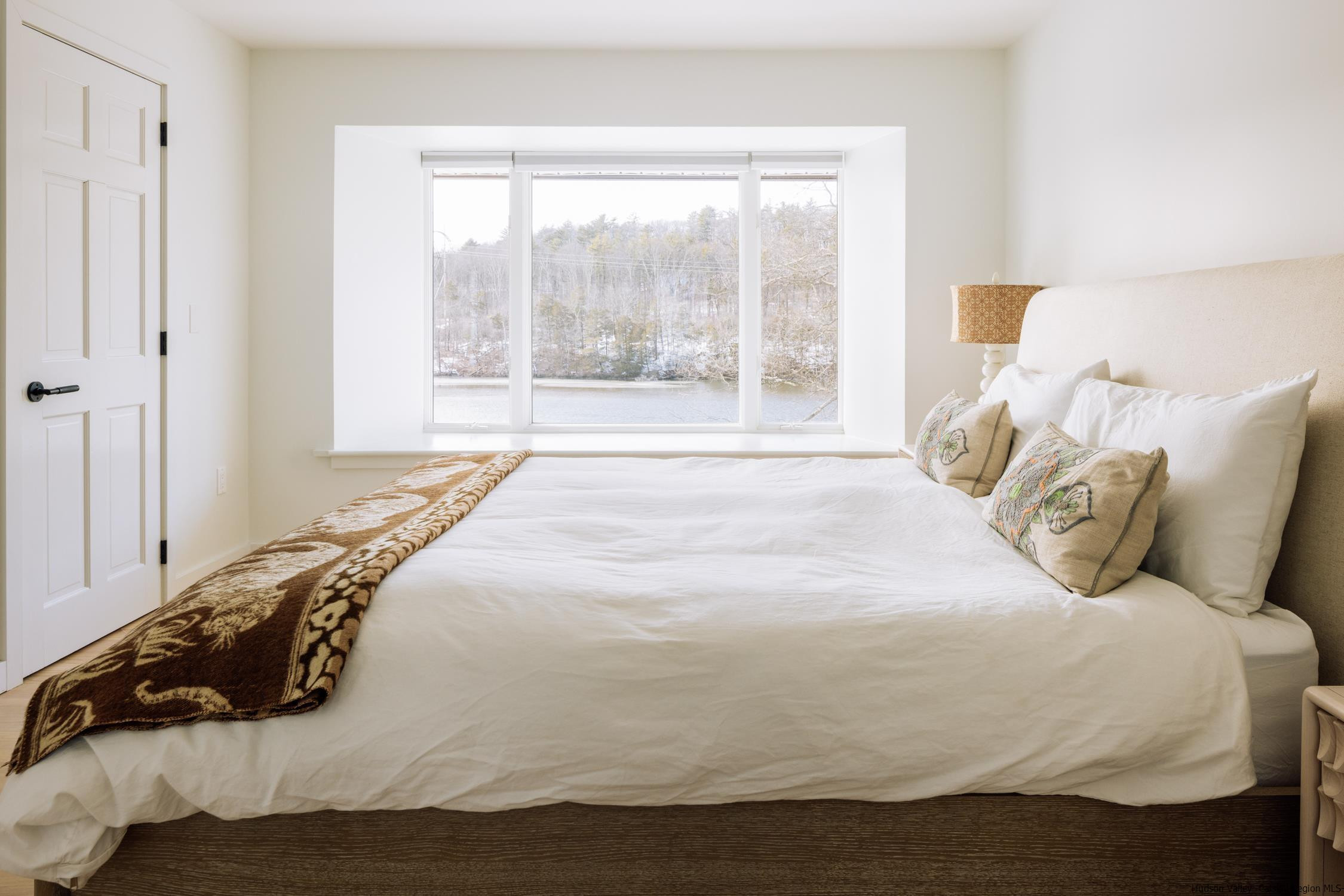 1849 Main Street Rifton, NY 12471 - Photo 20 of 30 a large bed sitting in a bedroom next to a window