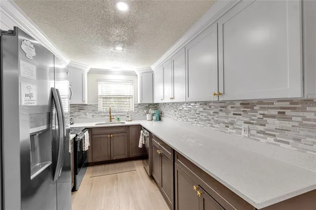 a kitchen with a table and chairs in it