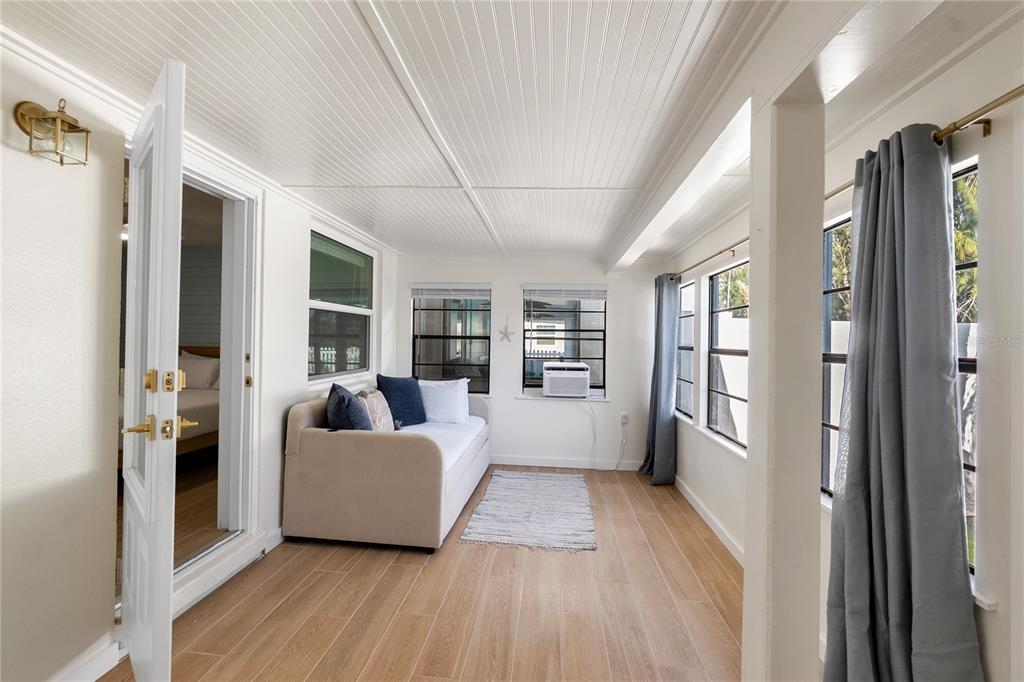 407 63rd Street Holmes Beach, FL 34217 - Photo 19 of 33 a living room with furniture and a large window