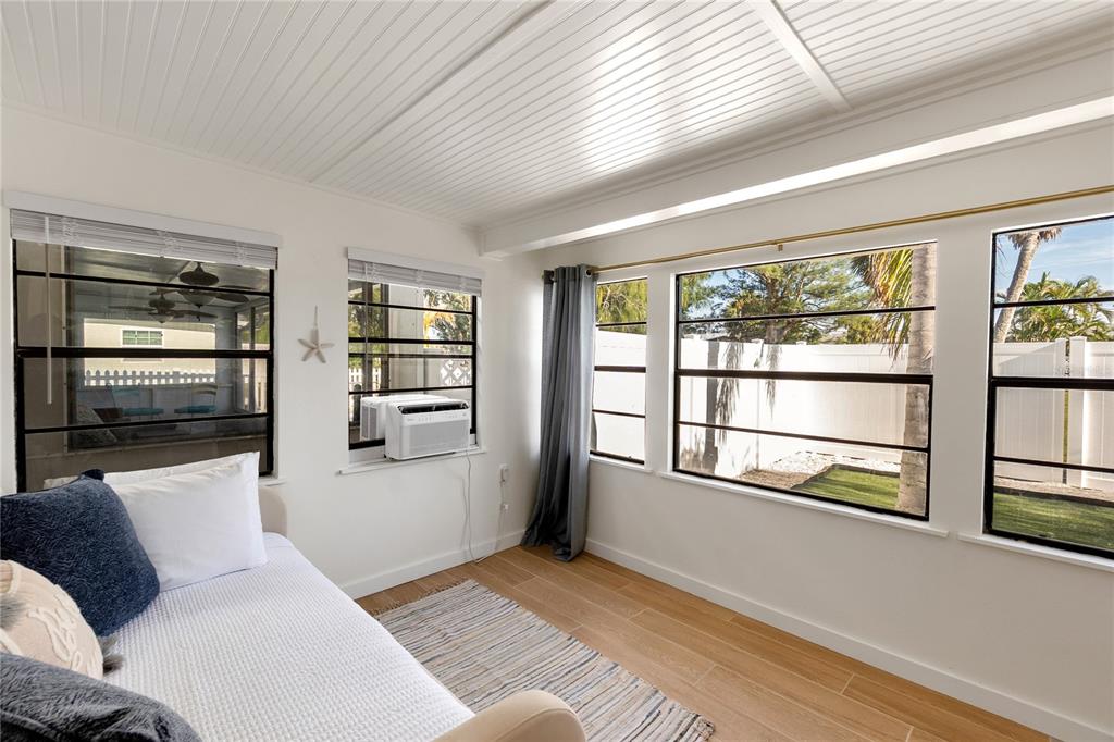 407 63rd Street Holmes Beach, FL 34217 - Photo 20 of 33 a living room with furniture and a window