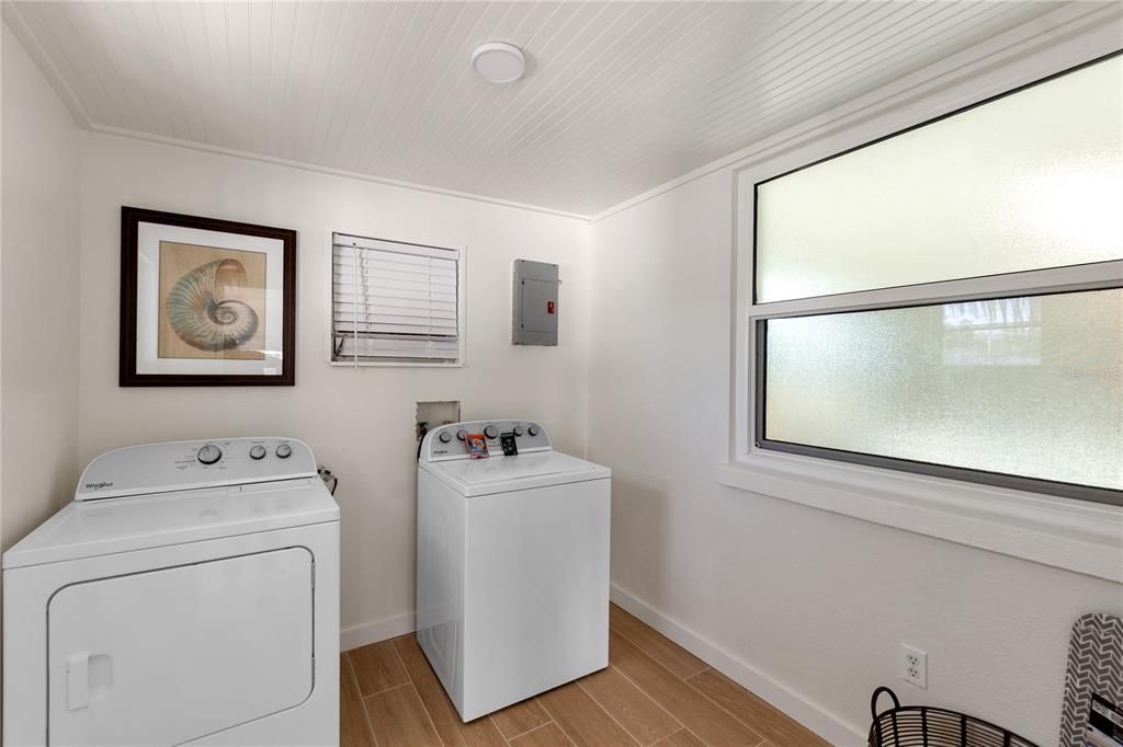 407 63rd Street Holmes Beach, FL 34217 - Photo 23 of 33 a utility room with dryer and washer