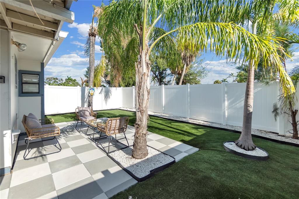 407 63rd Street Holmes Beach, FL 34217 - Photo 25 of 33 a view of yard with patio