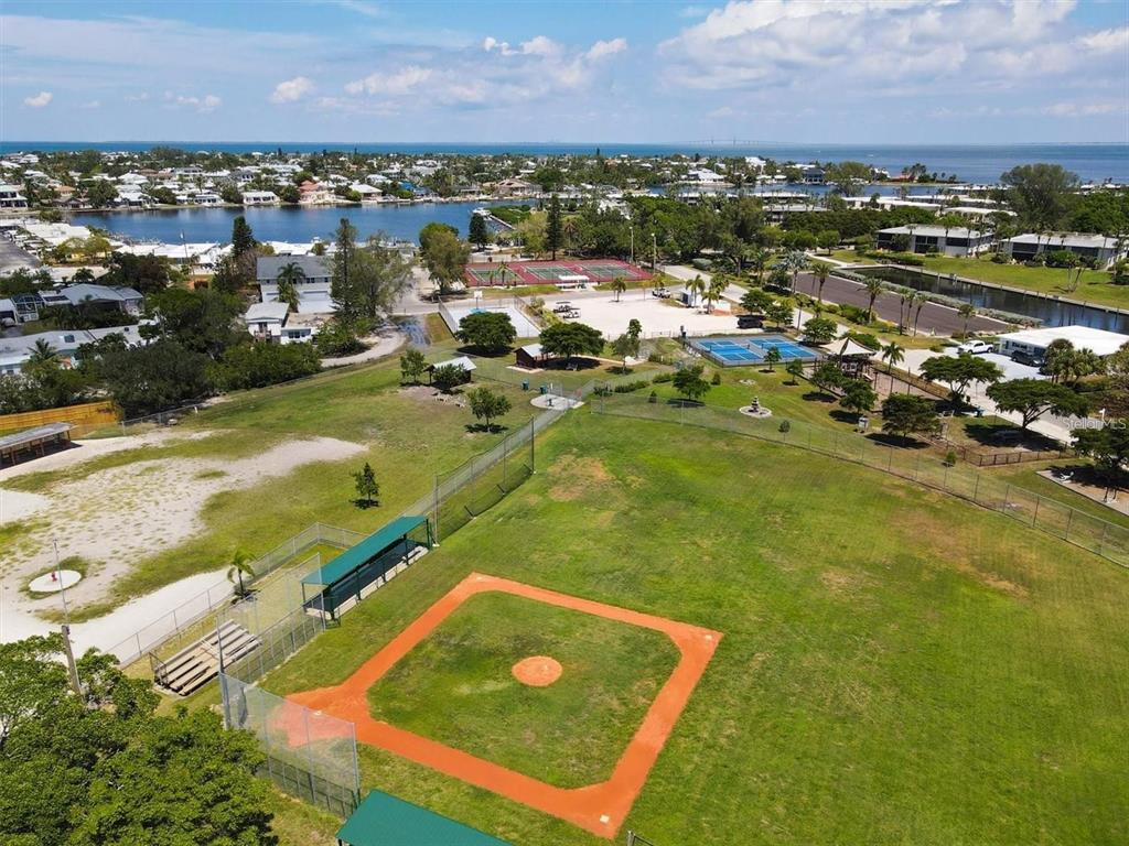 407 63rd Street Holmes Beach, FL 34217 - Photo 32 of 33 an aerial view of residential houses with outdoor space