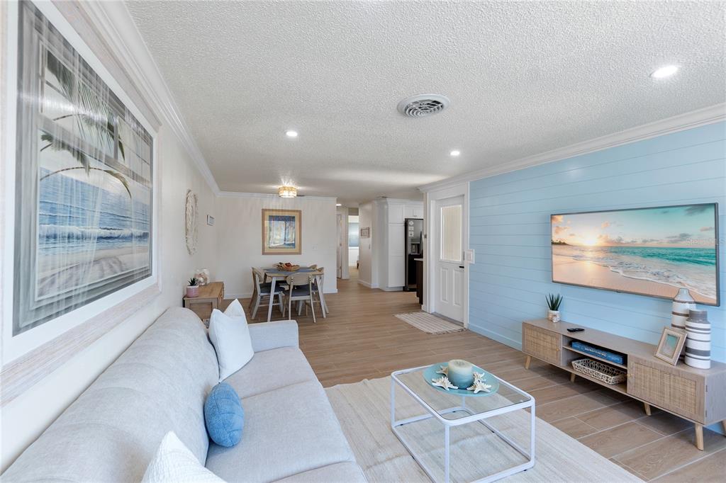 407 63rd Street Holmes Beach, FL 34217 - Photo 5 of 33 a living room with furniture and a flat screen tv