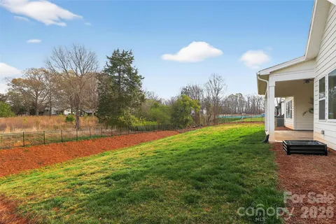 a view of a backyard of the house